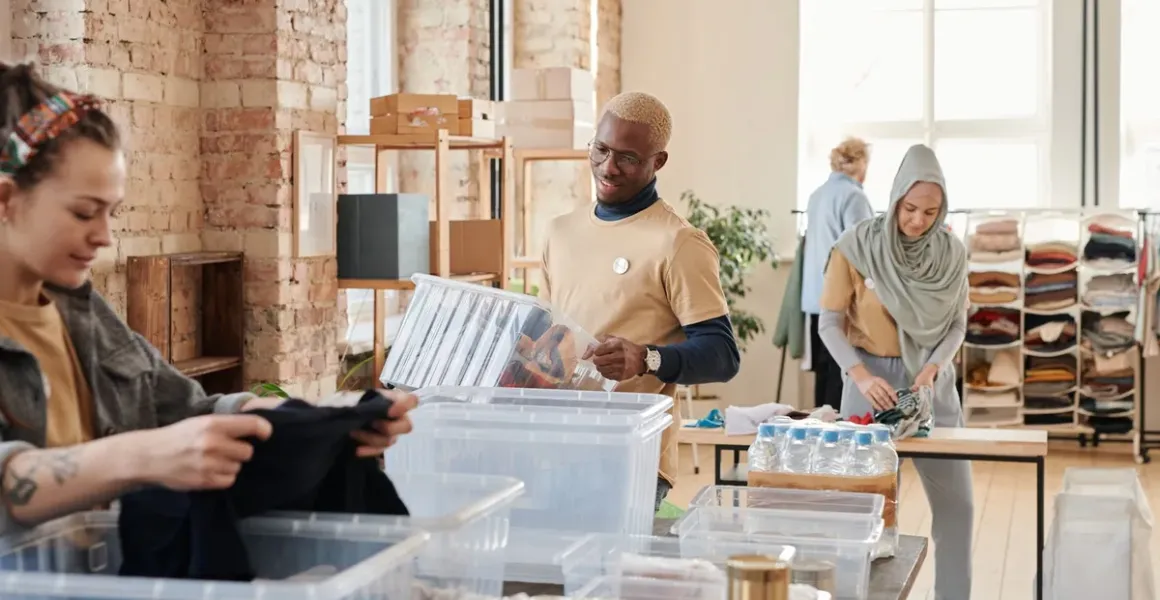 Volunteers organizing donations at a community center, illustrating nonprofit organizations work related to FATF Recommendation 8